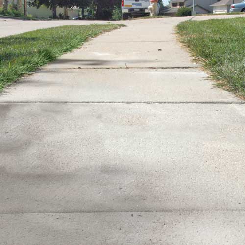 Leveled sidewalk Sidewalk after leveling