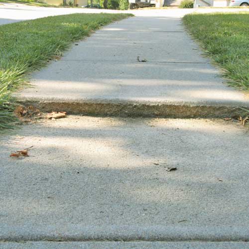 Sinking uneven sidewalk Sinking uneven concrete sidewalk