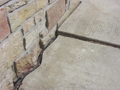 Sinking concrete sidewalk Sinking concrete sidewalk